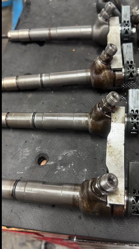 Four injectors on the workshop bench