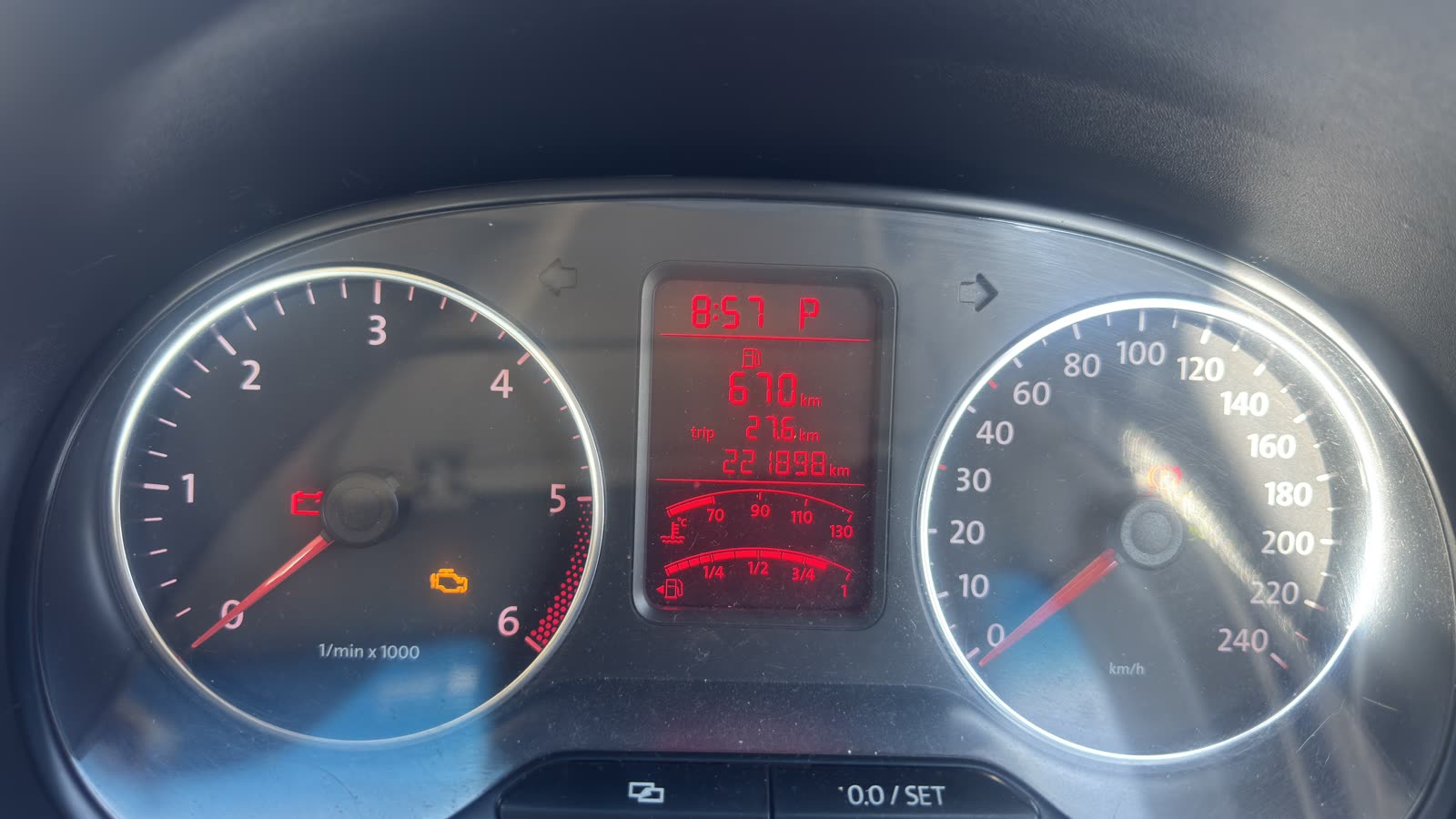 Instrument cluster with check engine light at 221,898 km